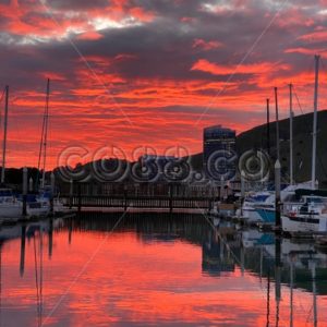 Dramatic Sunset with grey Clouds reflecting in the Water in small Marina located near San Francisco - CO88.co