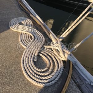 Tan Cloth Boat Rope (called a Mooring Line) coiled in a quite decorative Figure 8 Pattern with Cleat - CO88.co