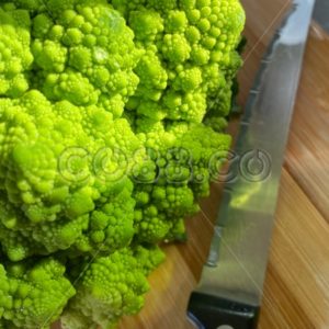 Organic Romanesco Broccoli (Roman Cauliflower) with Vegetables Kitchen Knife on Bamboo Cutting Board - CO88.co